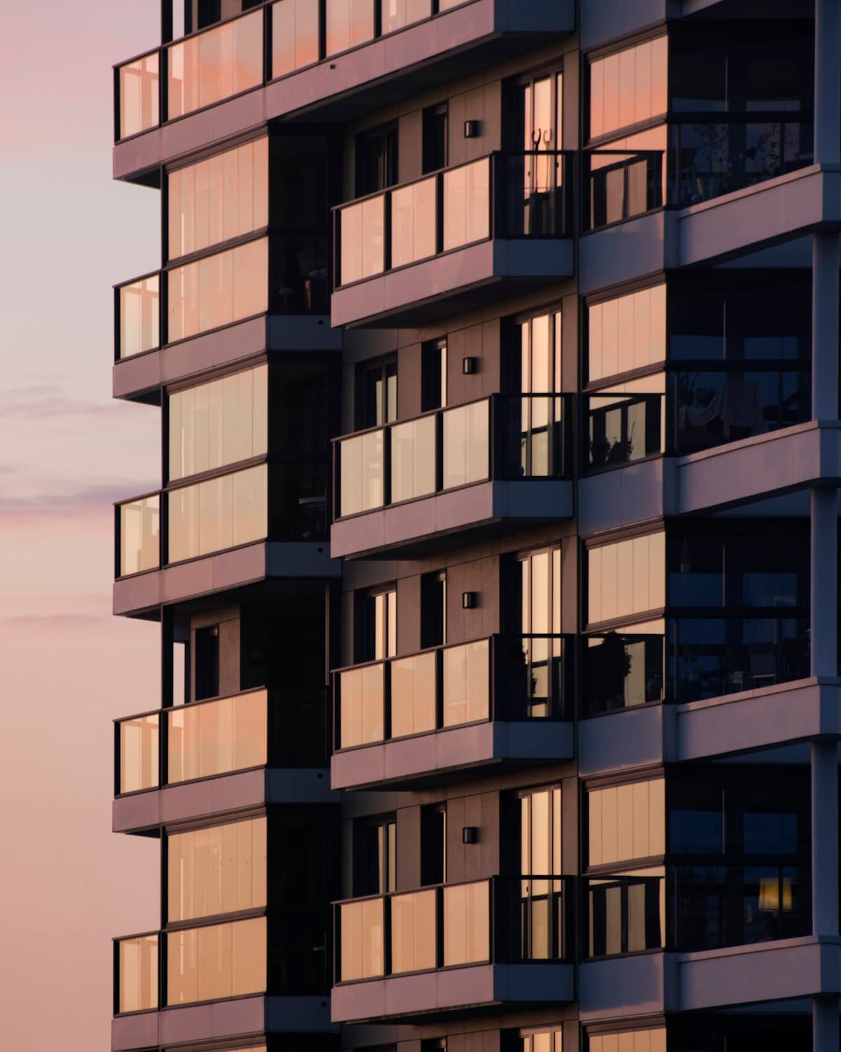 Apartment building elevation photographed at dusk
